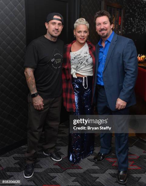 Freestyle motocross rider Carey Hart, recording artist Pink and The D Las Vegas Celebrity VIP Host Richard Wilk attend a surprise event in support of...