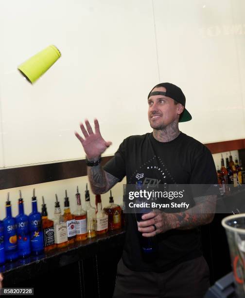 Freestyle motocross rider Carey Hart surprises guests as a bartender in support of Carey Hart's Good Ride Rally benefiting Infinite Hero Foundation...