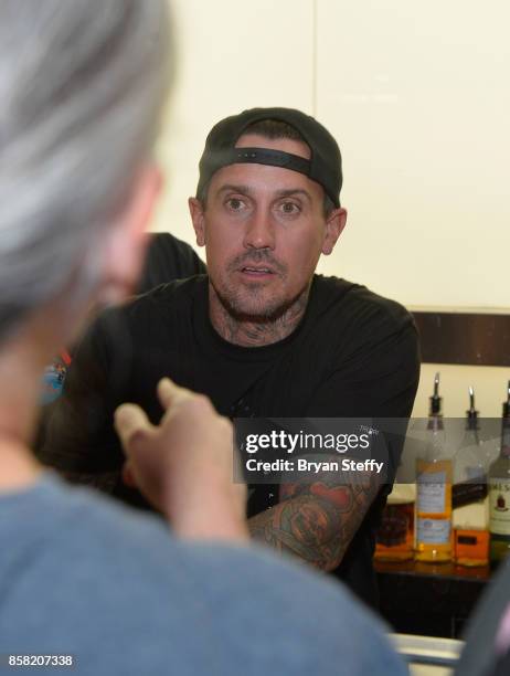 Freestyle motocross rider Carey Hart surprises guests as a bartender in support of Carey Hart's Good Ride Rally benefiting Infinite Hero Foundation...