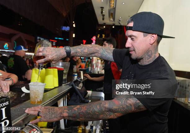 Freestyle motocross rider Carey Hart surprises guests as a bartender in support of Carey Hart's Good Ride Rally benefiting Infinite Hero Foundation...