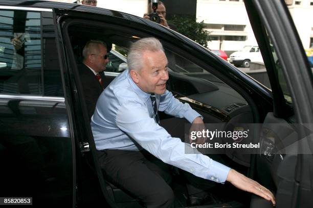 Ruediger Grube, a board member at automaker Daimler AG and chairman of Airbus parent EADS gets in the car after finshing the discussion of Germany's...