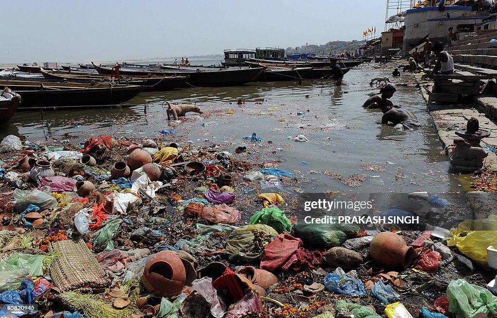Indian scavengers look for coins and oth