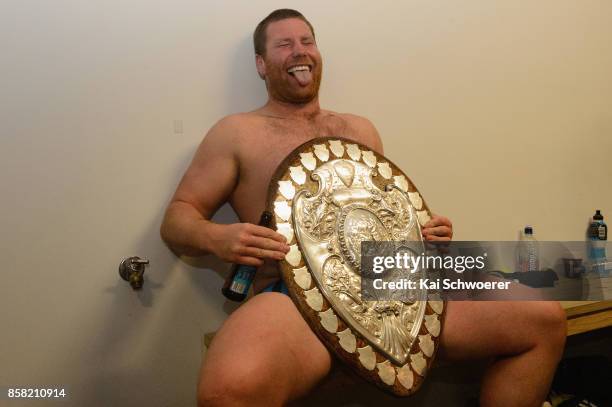 Mitchell Graham of Taranaki poses with the Ranfurly Shield after the win in the round eight Mitre 10 Cup match between Canterbury and Taranaki at AMI...