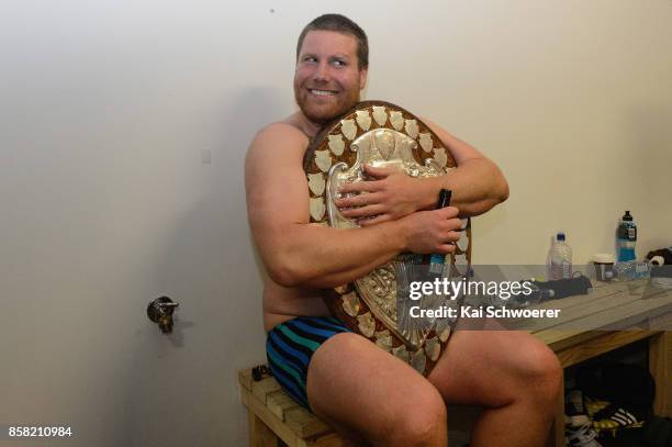 Mitchell Graham of Taranaki poses with the Ranfurly Shield after the win in the round eight Mitre 10 Cup match between Canterbury and Taranaki at AMI...