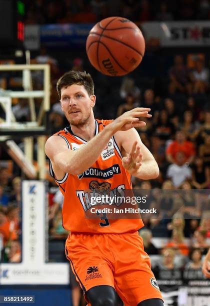 Cam Gliddon of the Taipans passes the ball during the round one NBL match between the Cairns Taipans and the Illawarra Hawks at Cairns Convention...