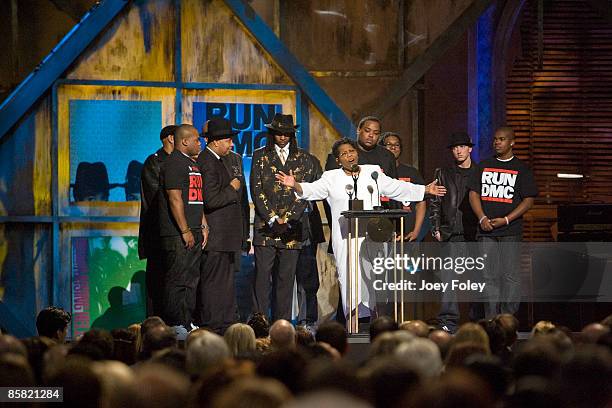 Connie Perry, mother of deceased Jason 'Jam Master Jay' Mizell speaks on stage besdie Eminem, Joseph Simmons and Darryl McDaniels during the 24th...