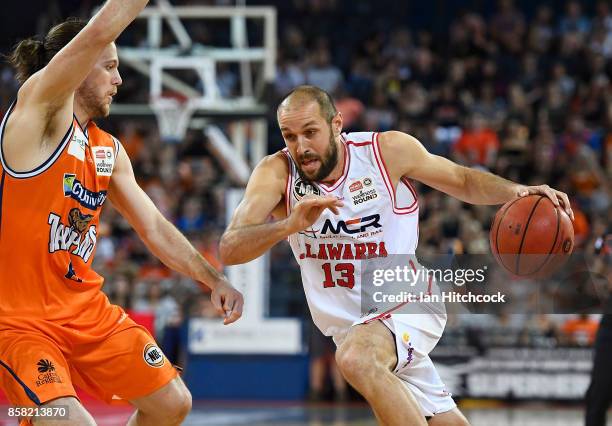 Rhys Martin of the Hawks drives to the basket during the round one NBL match between the Cairns Taipans and the Illawarra Hawks at Cairns Convention...