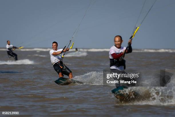 The Kite surfers compete during the 3rd Qidong YuanTuoJiao Kite Surfing Invitational Tournament on Day 1 at Qidong Golden Beach on October 6, 2017 in...