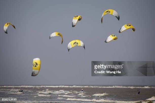 The Kite surfers competes during the 3rd Qidong YuanTuoJiao Kite Surfing Invitational Tournament on Day 1 at Qidong Golden Beach on October 6, 2017...
