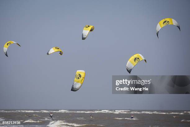 The Kite surfers competes during the 3rd Qidong YuanTuoJiao Kite Surfing Invitational Tournament on Day 1 at Qidong Golden Beach on October 6, 2017...