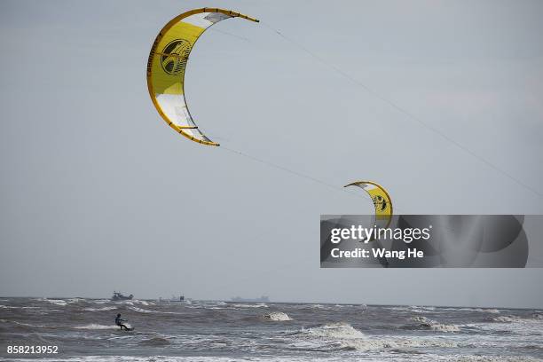 The Kite surfers competes during the 3rd Qidong YuanTuoJiao Kite Surfing Invitational Tournament on Day 1 at Qidong Golden Beach on October 6, 2017...