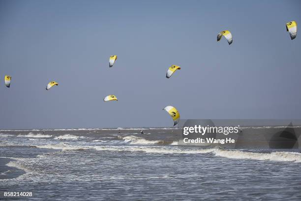 The Kite surfers competes during the 3rd Qidong YuanTuoJiao Kite Surfing Invitational Tournament on Day 1 at Qidong Golden Beach on October 6, 2017...