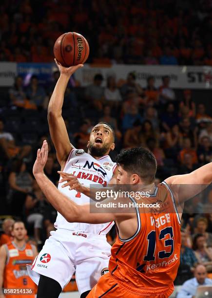 Demetrius Conger of the Hawks attempts a jump shot during the round one NBL match between the Cairns Taipans and the Illawarra Hawks at Cairns...