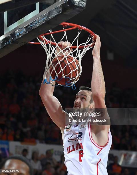 Andrew Ogilvy of the Hawks makes a dunk during the round one NBL match between the Cairns Taipans and the Illawarra Hawks at Cairns Convention Centre...