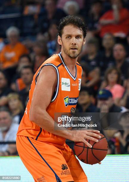 Alex Loughton of the Taipans looks to pass the ball during the round one NBL match between the Cairns Taipans and the Illawarra Hawks at Cairns...