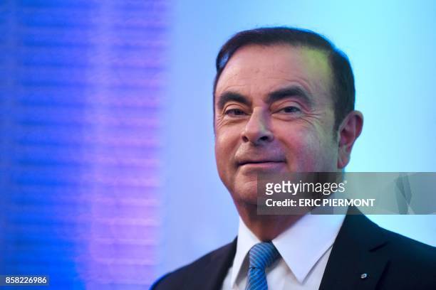 Renault-Nissan Chairman and CEO Carlos Ghosn looks on during a press confrence on the Renault strategic plan "Drive the Future 2017-2022", at la...