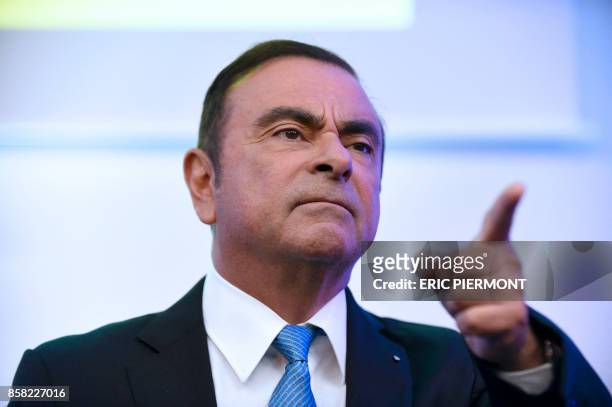 Renault-Nissan Chairman and CEO Carlos Ghosn gestures as he speaks during a press confrence on the Renault strategic plan "Drive the Future...