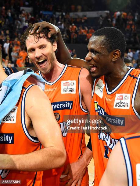 Alex Loughton and Nnanna Egwu of the Taipans celebrate after winning the round one NBL match between the Cairns Taipans and the Illawarra Hawks at...