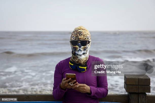 Woman wears a face-kini in Qidong Golden Beach during the 3rd Qidong YuanTuoJiao Kite Surfing Invitational Tournament on October 6, 2017 in Nantong,...