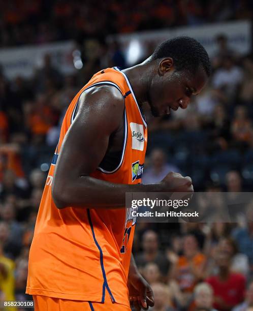 Nnanna Egwu of the Taipans reacts after a team mate scores a basket during the round one NBL match between the Cairns Taipans and the Illawarra Hawks...