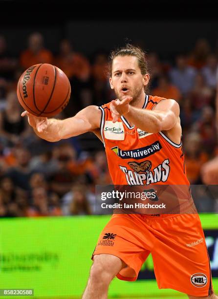 Damon Heir of the Taipans passes the ball during the round one NBL match between the Cairns Taipans and the Illawarra Hawks at Cairns Convention...