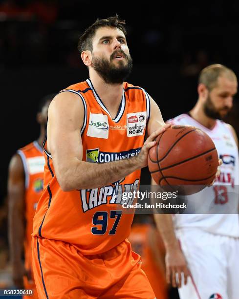 Jarrad Weeks of the Taipans attempts to make a free throw shot during the round one NBL match between the Cairns Taipans and the Illawarra Hawks at...