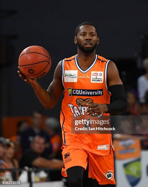 Scoochie Smith of the Taipans dribbles the ball during the round one NBL match between the Cairns Taipans and the Illawarra Hawks at Cairns...