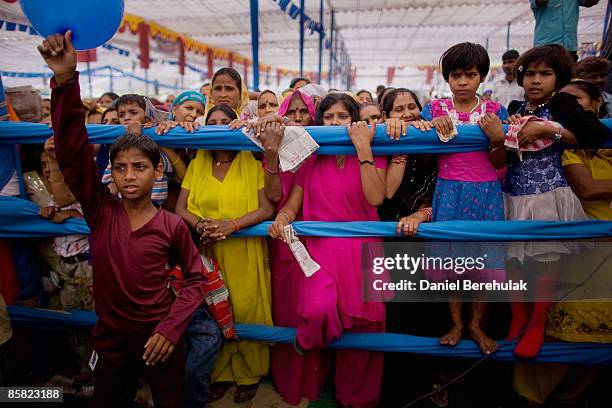 Supporters of Mayawati Kumari, of the Bahujan Samaj Party and Chief Minister of Uttar Pradesh state listen to her speech during a political rally on...