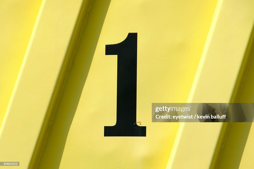 Number 1 on a yellow panel