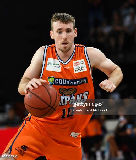 Mitch McCarron of the Taipans drives to the basket during the round one NBL match between the Cairns Taipans and the Illawarra Hawks at Cairns...