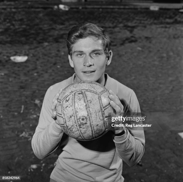 English professional footballer Dave Metchick of Fulham FC holding a soccer ball, UK, 4th September 1964.