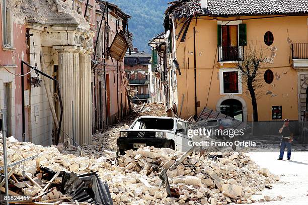 Fiat Panda rests on rubble in a street in the historical town of L'Aquila on April 6, 2009 in L'Aquila, Italy. The 6.3 magnitude earthquake tore...