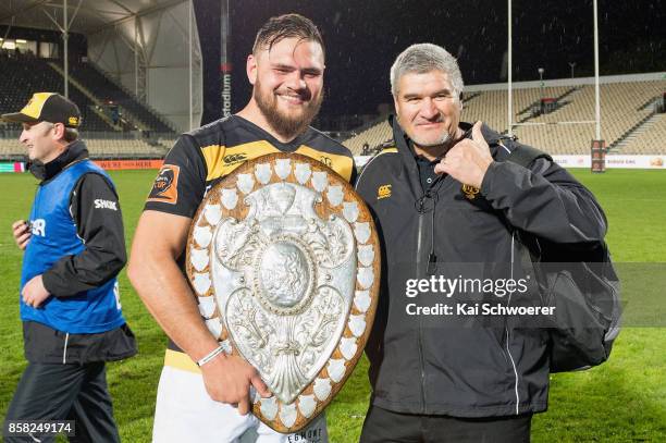 Captain Angus Ta'avao of Taranaki and Head Coach Colin Cooper of Taranaki pose with the Ranfurly Shield after their win in the round eight Mitre 10...