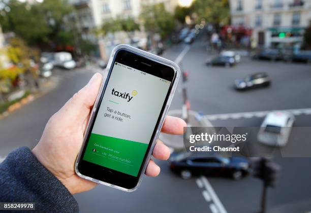 In this photo illustration, the Taxify company application is displayed on the screen of an Apple iPhone 6 on October 06, 2017 in Paris France. The...