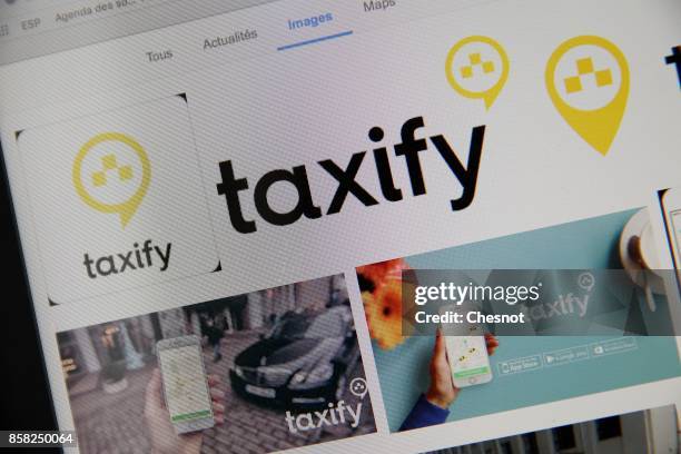 In this photo illustration, Taxify company logos are displayed on a laptop screen on October 06, 2017 in Paris France. The new car-hailing service...