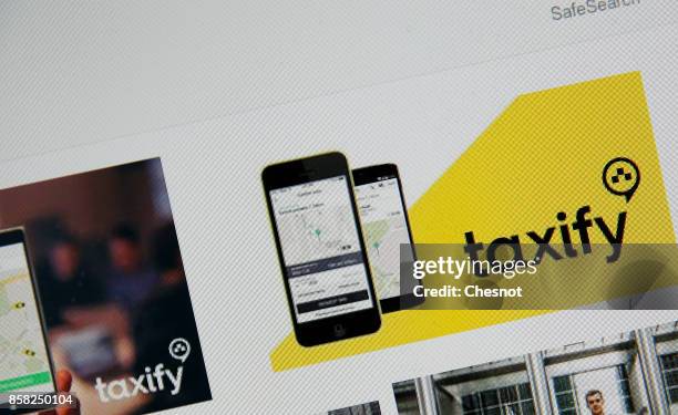 In this photo illustration, Taxify company logos are displayed on a laptop screen on October 06, 2017 in Paris France. The new car-hailing service...