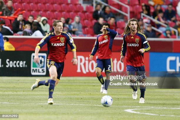 Will Johnson and Kyle Beckerman of Real Salt Lake kick the ball during the game against the Columbus Crew at Rio Tinto Stadium on April 2, 2009 in...