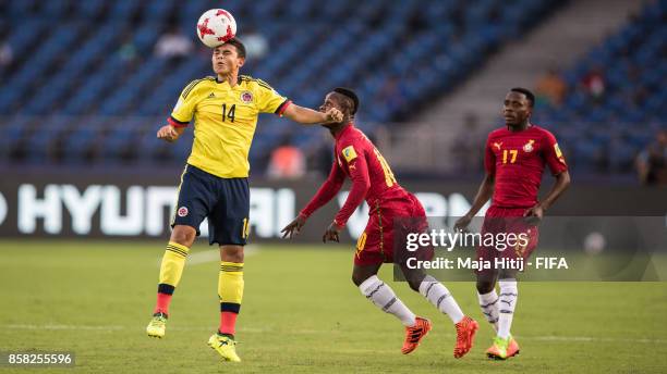 Yadir Meneses of Columbia and Emmanuel Toku of Ghana battle for the ball during the FIFA U-17 World Cup India 2017 group A match between Colombia and...