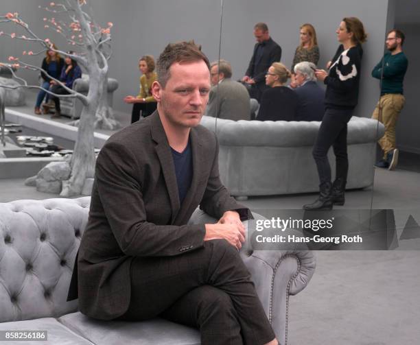 The artist Hans Op de Beck sitting in his work 'The Garden Room', 2017 seen during the 'Perception is Reality: Ueber die Konstruktion von...