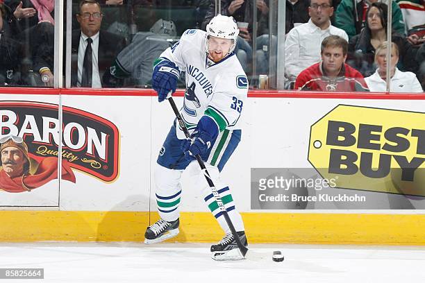 Henrik Sedin of the Vancouver Canucks delivers a pass against the Minnesota Wild during the game at the Xcel Energy Center on March 31, 2009 in Saint...