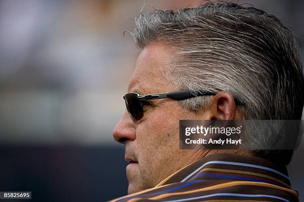 General Manager Kevin Towers of the San Diego Padres watches Stephen Strasburg of the San Diego State Aztecs pitch during the game against the UC...