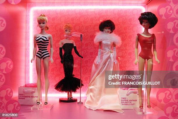 Barbie dolls are displayed on April 6, 2009 in Paris during the "Barbie Fashion show 2009", an exhibition dedicated to the world's most famous toy,...