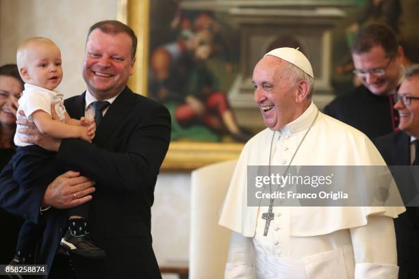 Pope Francis meets Lithuania Prime Minister Saulius Skvernelis and his son Tadas during an audience at the Apostolic Palace on October 6, 2017 in...