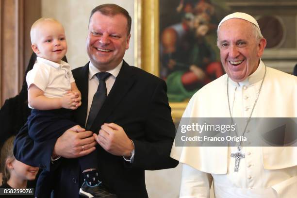 Pope Francis meets Lithuania Prime Minister Saulius Skvernelis and his son Tadas during an audience at the Apostolic Palace on October 6, 2017 in...