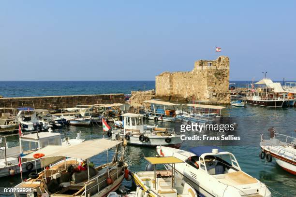 boats in the harbour of the old city of byblos, unesco world heritage site, lebanon - byblos stock pictures, royalty-free photos & images