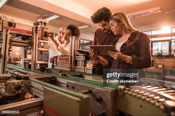 group of scientist working on engineering project in a laboratory. - students plant lab stock pictures, royalty-free photos & images