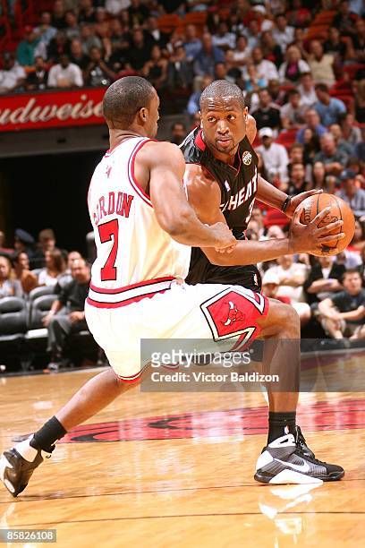 Dwyane Wade of the Miami Heat goes up against Ben Gordon of the Chicago Bulls during the game on March 9, 2009 at American Airlines Arena in Miami,...