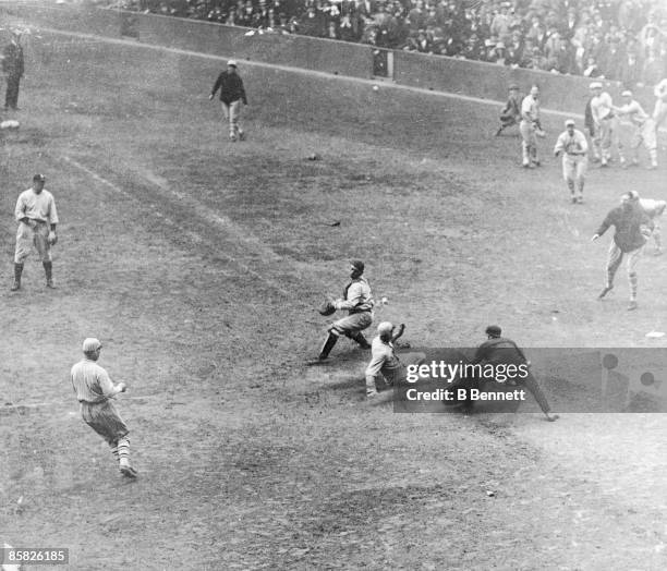 American baseball player Casey Stengel of the New York Giants scroes during game one of the World Series against the New York Yankees at Yankee...