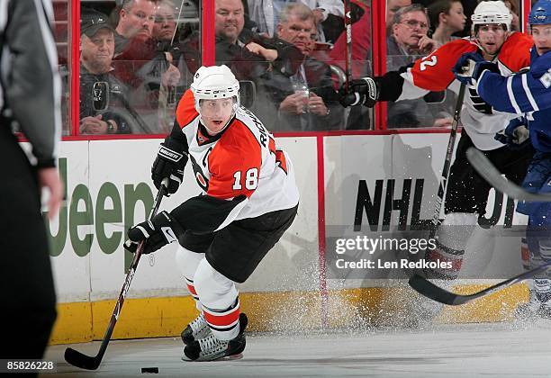 Mike Richards of the Philadelphia Flyers skates the puck along the boards against the Toronto Maple Leafs on April 3, 2009 at the Wachovia Center in...