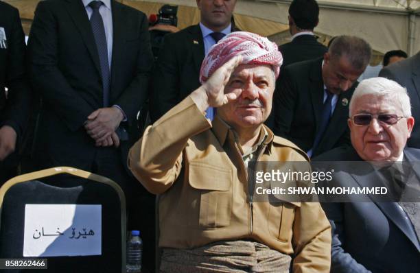 Iraqi Kurdish leader Massud Barzani sits next to Iraqi President Fuad Massum during a ceremony at the airport in the Iraqi Kurdish city of...